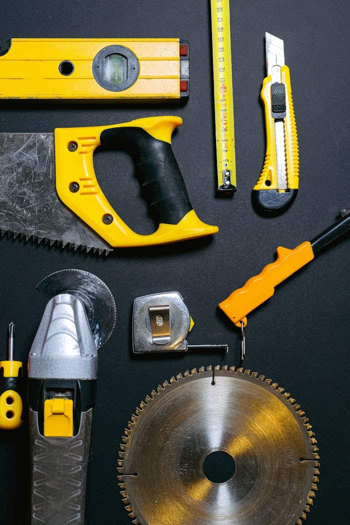 Red and Yellow Hand Tools on the Table